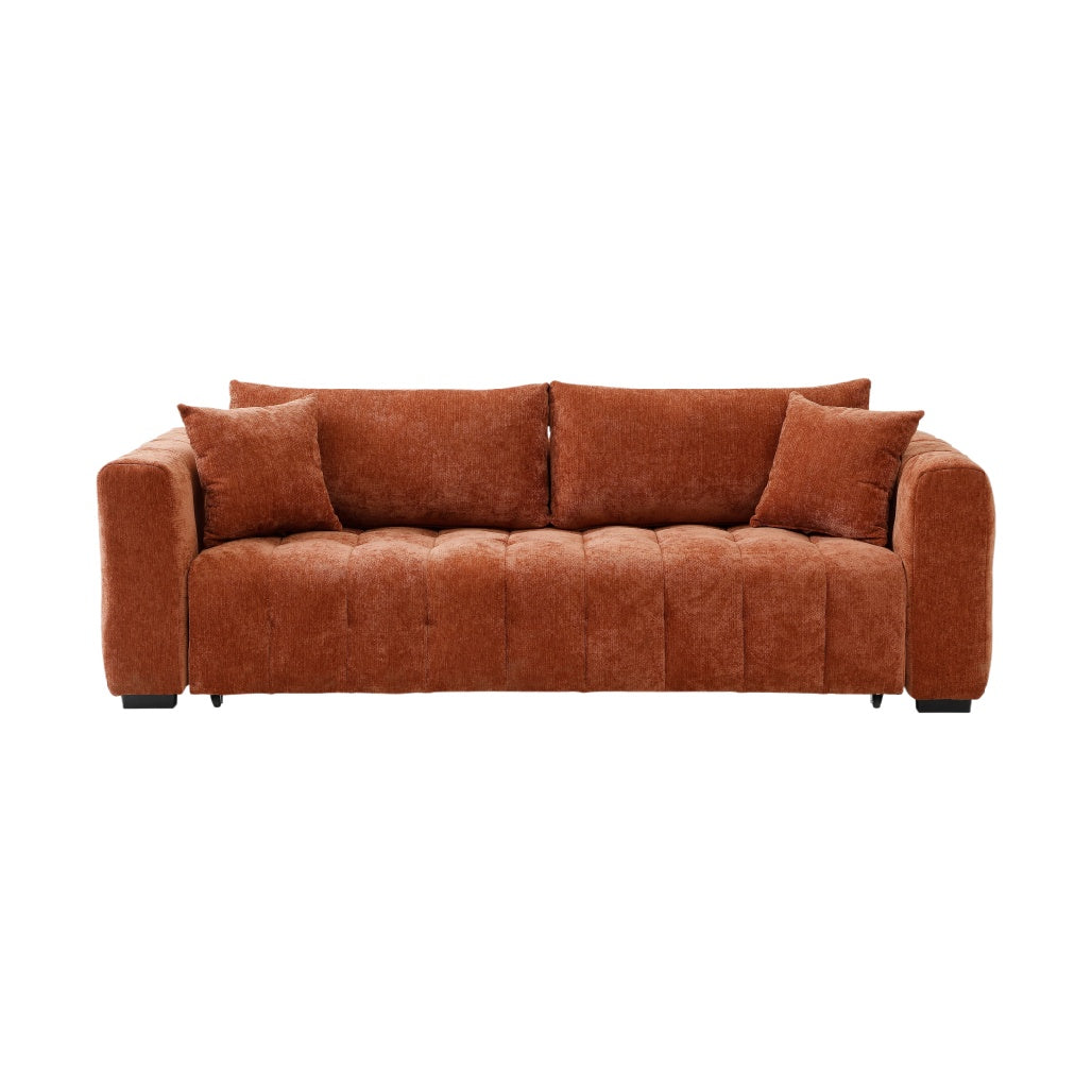 Sofa en velours côtelé couleur terracotta avec coussins assortis.